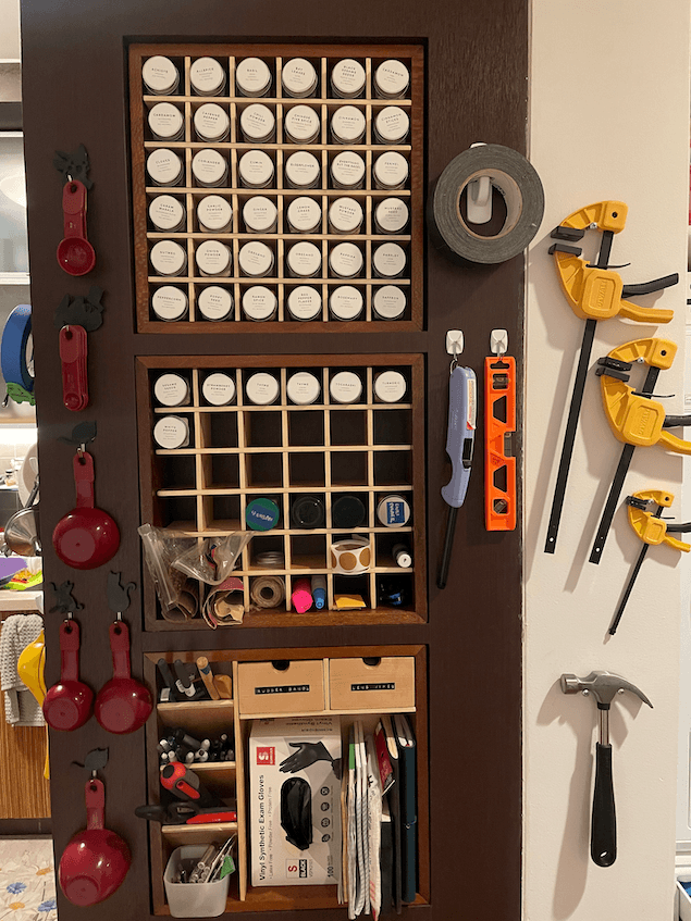 Turns out the spice rack cubby holes can hold anything cylindrical.