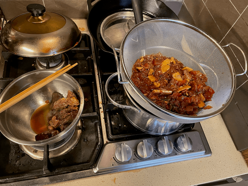 If you don't have an extra pot to strain the soup into, you can scoop up the solids in the same pot with your strainer.